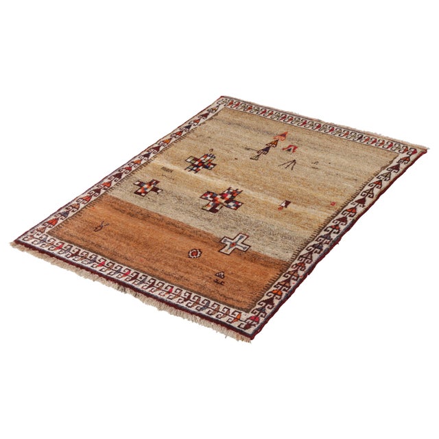 Hand knotted in wool originating circa 1950-1960, this vintage Persian rug connotes a mid-century Persian rug design with...