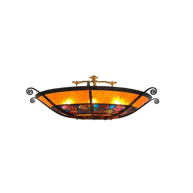 A large French round stained glass chandelier, circa 1900 A stained glass chandelier, set in wrought iron with a grape...