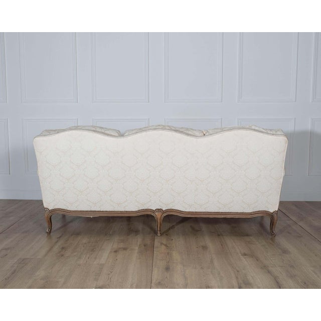 Wood Mid 20th Century Louis XV Style Carved Walnut Sofa with Cream Damask Upholstery For Sale - Image 7 of 8