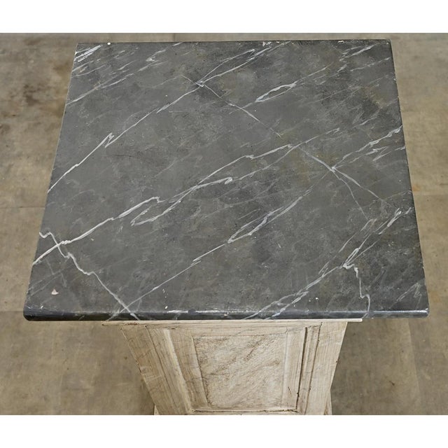 An infinitely useful square display pedestal from France, 19th century, covered on three sides in meticulously hand-...