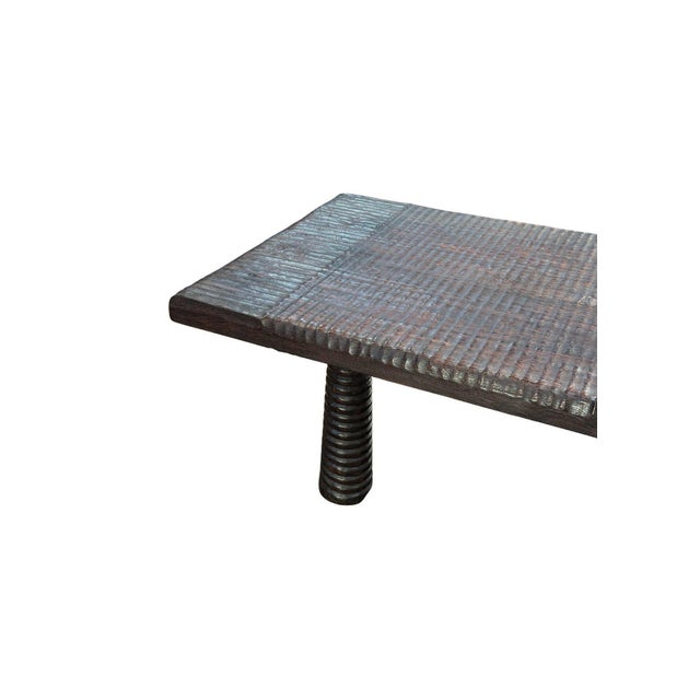 Handcrafted from solid suar wood, this sculptural coffee table is a celebration of natural materiality and refined...
