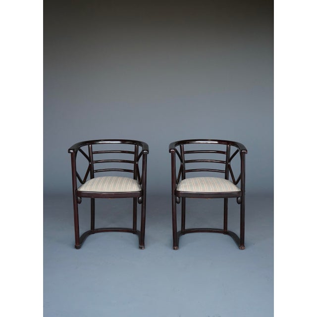 A set of two Josef Hoffman model 728 armchairs. Originally designed for the famous Fledermaus Cabaret and manufactured by...
