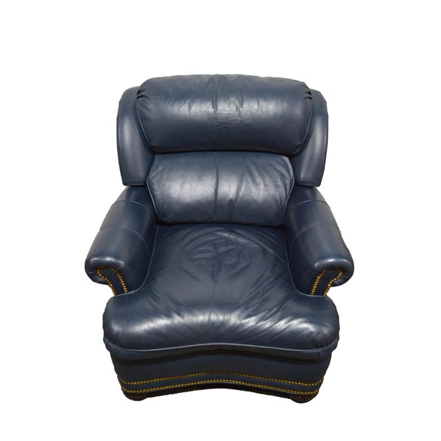An elegant, traditional, Hancock & Moore leather lounge chair in a rich blue. The chairs is composed of Soft and luxurious...