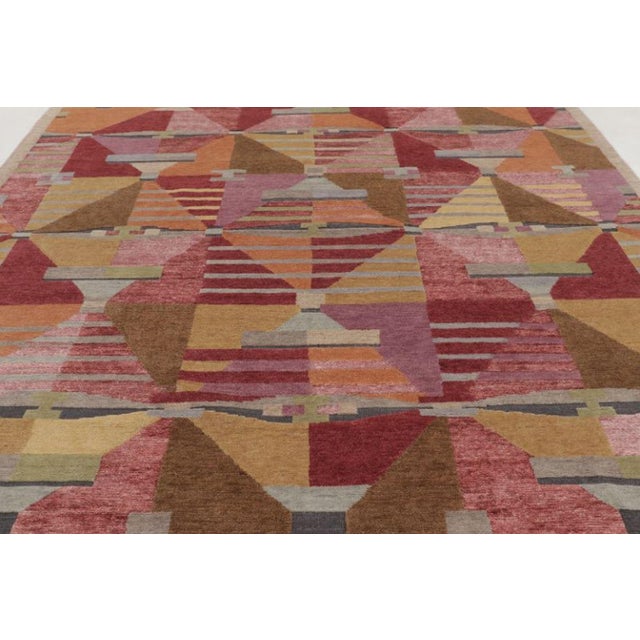 This oversized 10x14 Scandinavian rug explores modern geometry through an expressive composition of layered forms and...