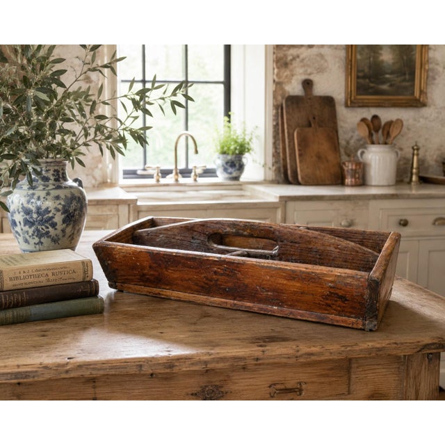 A substantial early 20th-century wooden trug or tool caddy with a beautifully worn surface developed through generations...