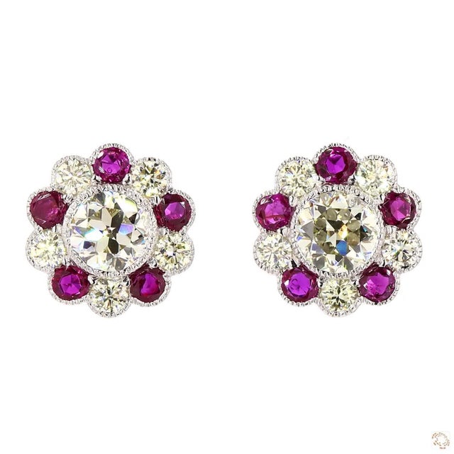 This pair of estate earrings, a 1940s design, centers on a 2.79-carat diamond in a round brilliant cut for lively, classic...