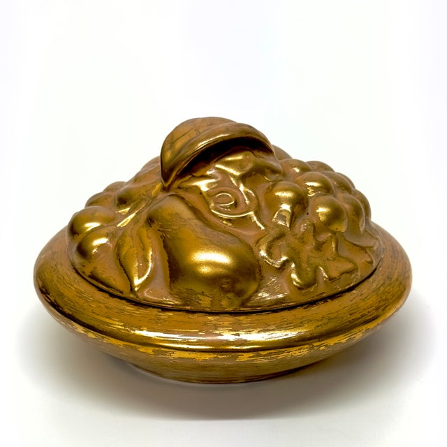 This is a stunning Majolica-style lidded candy dish by Stangl Pottery, circa 1950s. Crafted in a warm tan glaze and hand-...