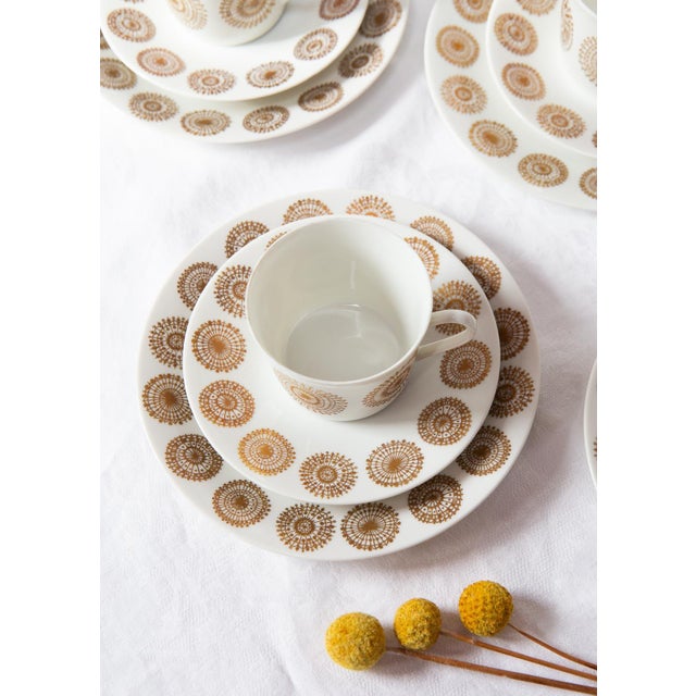 The motif of this Nordic-style set consists of a series of circular gold medallions with fine gold decals that repeat...