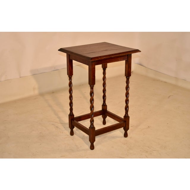 Period Edwardian oak side table from England. The top has a double beveled edge, surrounding a nicely grained top. The top...