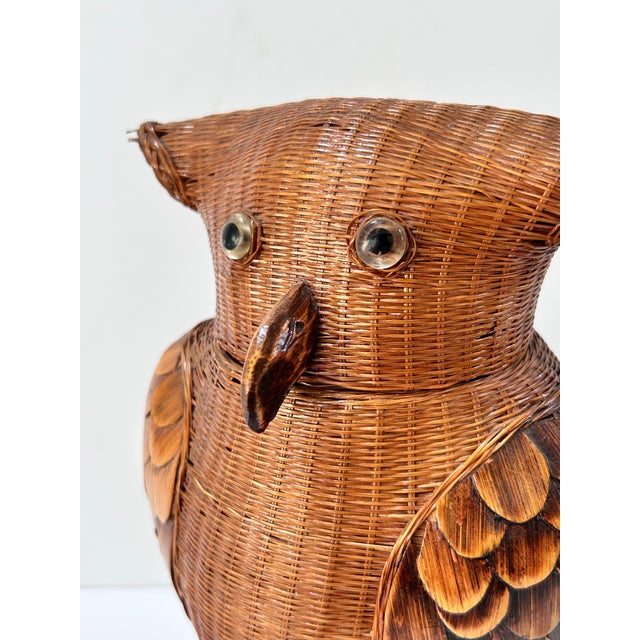 Vintage wicker owl basket with a removable head-shaped lid, layered wooden wings and a carved wooden beak. Round inset...
