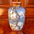 A large and unusual Japanese vase in a spectacular color palette of turquoise, orange and gold, featuring birds and...
