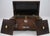 Antique Rosewood and Mother of Pearl Inlay with Bun Feet and Sarcophagus Form In used condition, that comes with multiple...