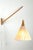 Luxus wall lamp model number 534 exists in several versions. The wood parts were made in oak or teak and the shades were...