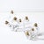 This exquisite pair of mid-century four-arm candelabra, signed Schneider, exudes the timeless grace and refinement...