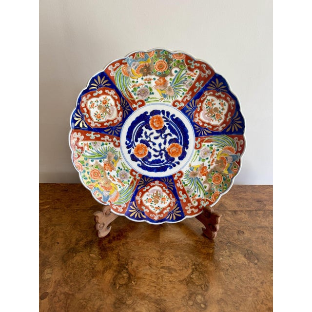 Fine quality large antique Japanese Imari plate, having a quality large antique Japanese Imari plate with a central floral...