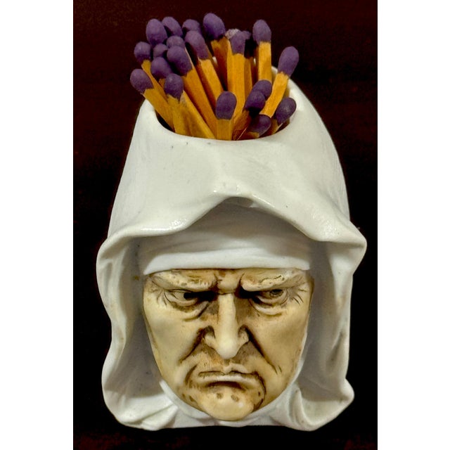 Rare German Porcelain Figural Matchstrike Frowning Nun Unmarked, Attributed to Schafer & Vater A rare and highly...