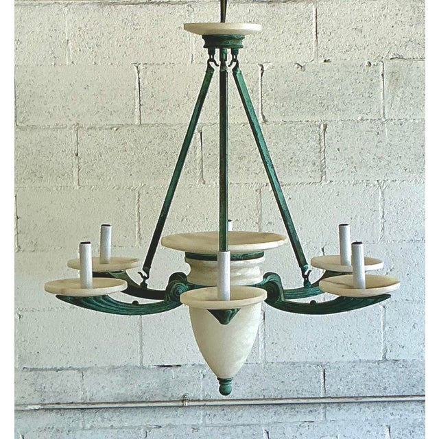 Elevate your home with the understated elegance of this vintage Nulco chandelier, a beautiful fusion of timeless design...