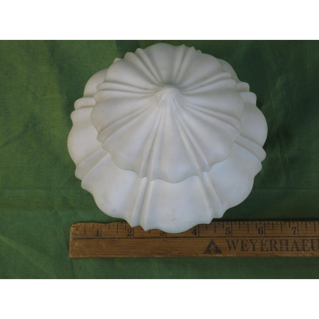 The Light Shade Frosted Glass Vintage Empire is a medium-sized antique light shade from the 1920s, made of white glass in...