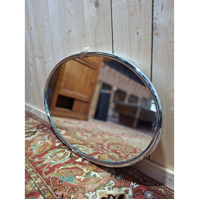 Discover this oval chrome mirror, an iconic piece from the Art Deco era that will bring a touch of timeless elegance to...