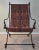 Outstanding iron chair with a "Persian rug" tapestry style upholstery sling and ornate brass finials. Nicely made and...