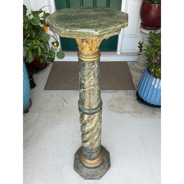 Offering for sale this incredible solid antique-style green Verde Antico marble pedestal with the following fine features:...