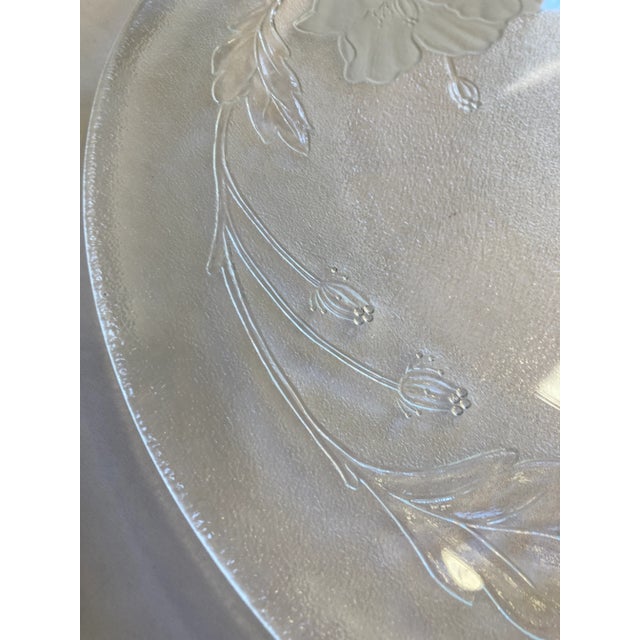Large platter with floral etching on the bottom. Very heavy and well made.