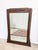 Exquisite antique mirror with a carved oak frame featuring a skyscraper motif typical of the Art Deco period in France....