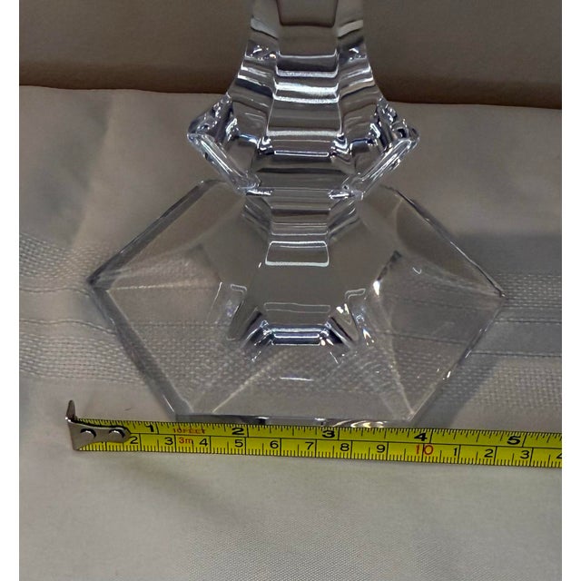 Elevate your tablescape or mantel with this striking, heavy-lead crystal pair of single-light candlesticks by the master...