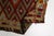 This is a vintage Turkish Oushak rug from the Mid 20th Century. The piece was hand-knotted.