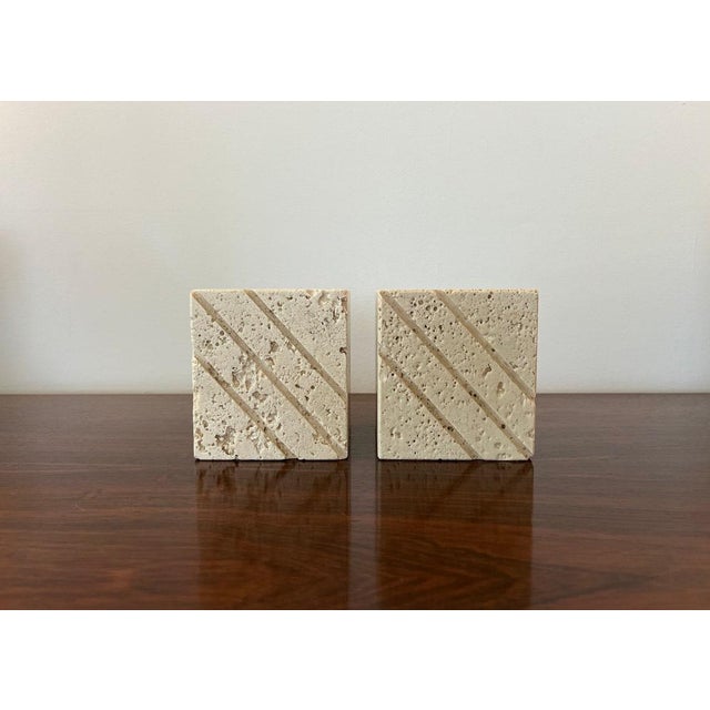 Awesome pair of bookends in travertine by Fratelli Mannelli. Neat cube design, heavy and nicely aged. Small chip on one...