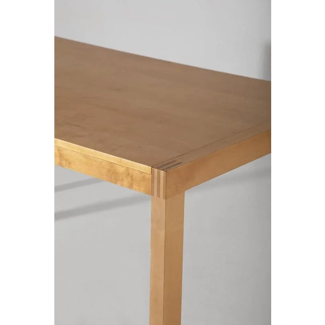 This wooden dining table represents an authentic masterpiece of Italian craftsmanship from the 1970s. Its majestic...