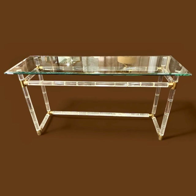 Lucite & Brass “Bamboo” Console Table attr. to Charles Hollis Jones, with original beveled glass top. Made in the 1960s,...