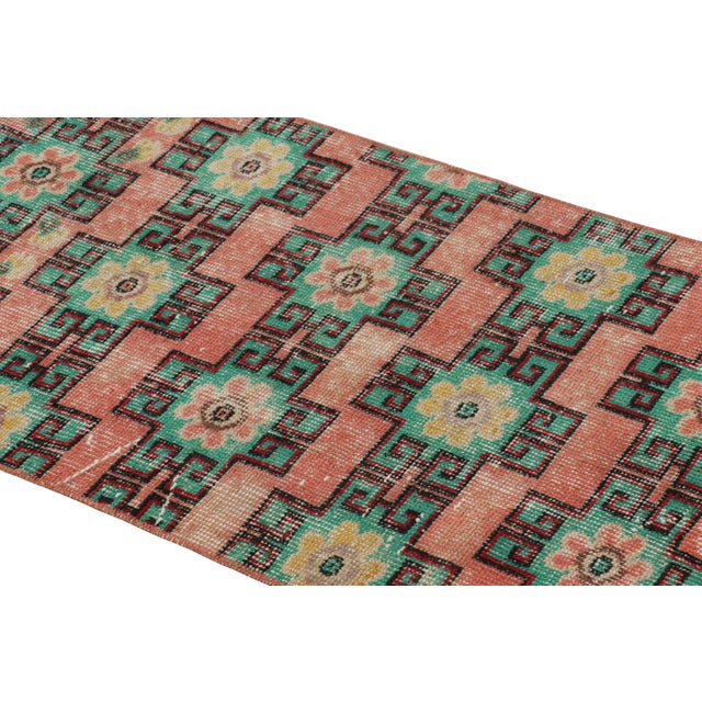 Hand-knotted in wool and originating from Turkey circa 1960 – 1970, this 2x5 vintage Zeki Müren runner is a unique...