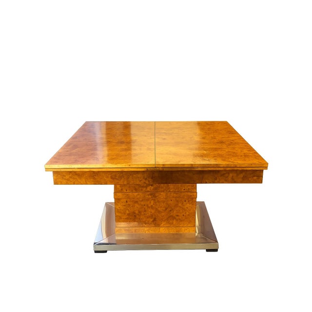 Extendable dining table with 6 chairs and 2 armchairs from a significant Viennese ensemble This exceptional dining set...