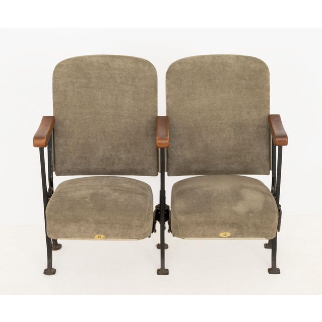 Pair of Bouwerie Lane Theater Beige Upholstered Seats, with carved wood handles on cast iron frames, brass labels "10" and...
