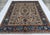 This hand-knotted Khotan-style rug features a refined allover lattice of diagonal vines and angular palmettes in rust,...