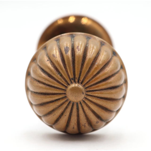Vintage fluted entry door knobs made of brass with an antique and polished finish. Good condition with surface wear from...