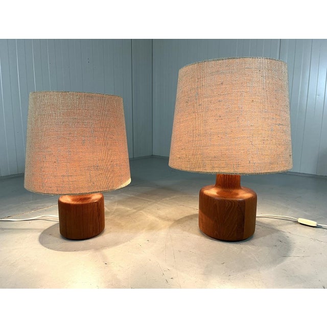 A set of 2 stylish table lamps by Bestform Germany (marked). Solid teak wooden stands, beige fabric shades (original). The...