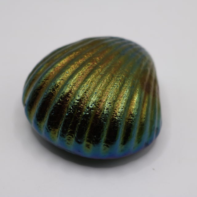Bring a luminous touch of the coast to your bookshelf, desktop, or vanity with this exquisite studio art glass paperweight...