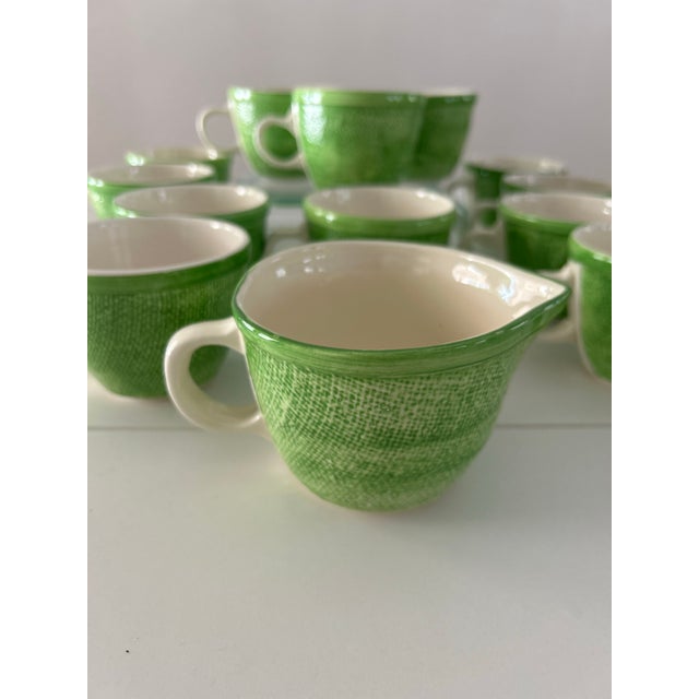 Vintage, light green, textured "burlap" coffee mugs with matching creamer. Pristine condition. 12 mugs & 1 creamer.