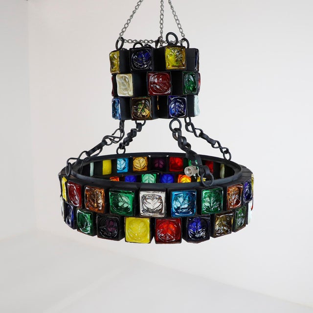 This chandelier is one of the most stunning samples of Brutalist art, made of steel and multicolored blown glass, each...