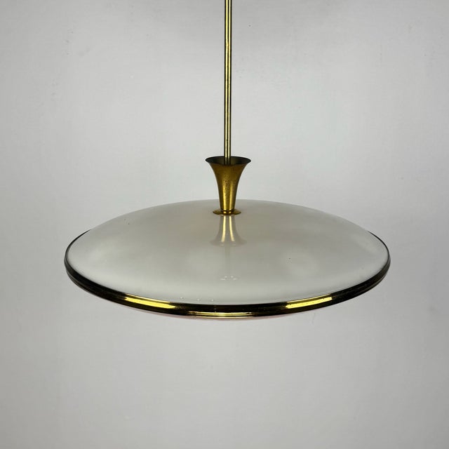 Mid-Century UFO Pendant Light in BRass and Glass by Pietro Chiesa for Fontana Arte, Italy, 1950s, in Very Good conditions....
