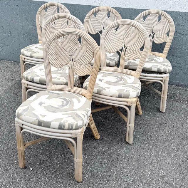 A beautifully sculpted set of Boho Chic dining chairs, crafted in pencil reed rattan with an elegant, nature-inspired...