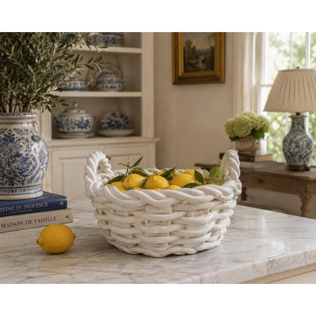 A beautifully modeled Italian ceramic basket from the 1980s, designed as a trompe l’oeil interpretation of handwoven...