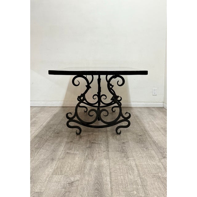 Beautiful black solid wood dining table with wrought iron legs in good condition