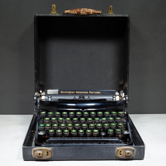 ABOUT This beautifully preserved Art Deco 1937 Remington Rand portable noiseless typewriter features a striking black high...