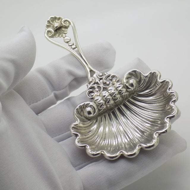 A vintage decorative spoon in the shape of a shell, crafted in Padua between the 1980s and 1990s in solid sterling silver....