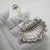A vintage decorative spoon in the shape of a shell, crafted in Padua between the 1980s and 1990s in solid sterling silver....