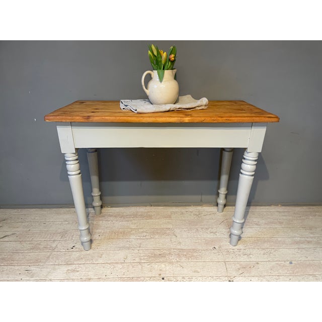 This charming antique table has been given a fresh coat of paint, sanded, and oiled. Width: 100 cm Depth: 49 cm Height: 75...