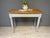 This charming antique table has been given a fresh coat of paint, sanded, and oiled. Width: 100 cm Depth: 49 cm Height: 75...